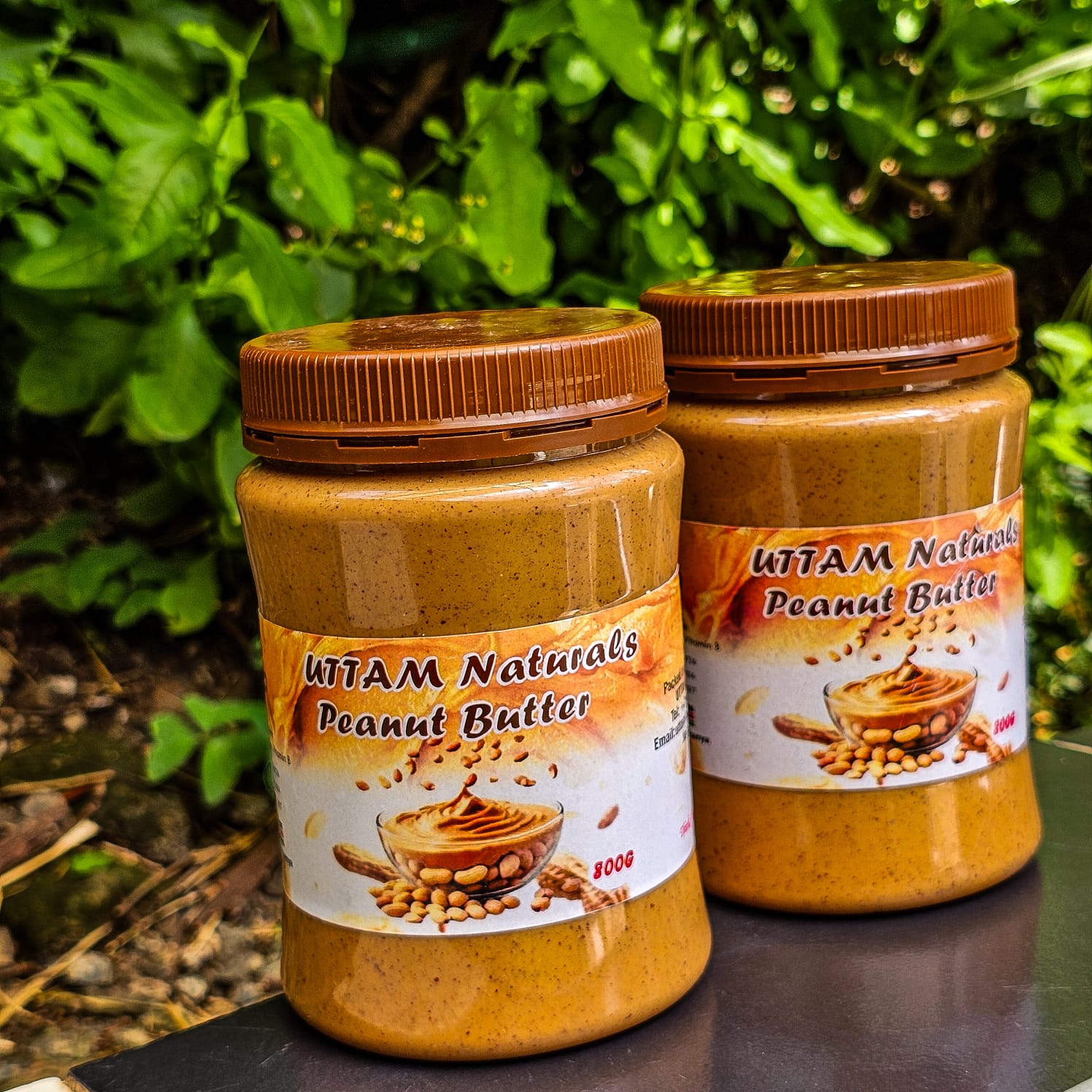Two jars of Uttam Naturals peanut butter